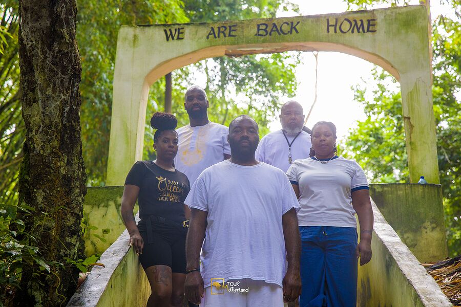Under the arch that reads: we are back home