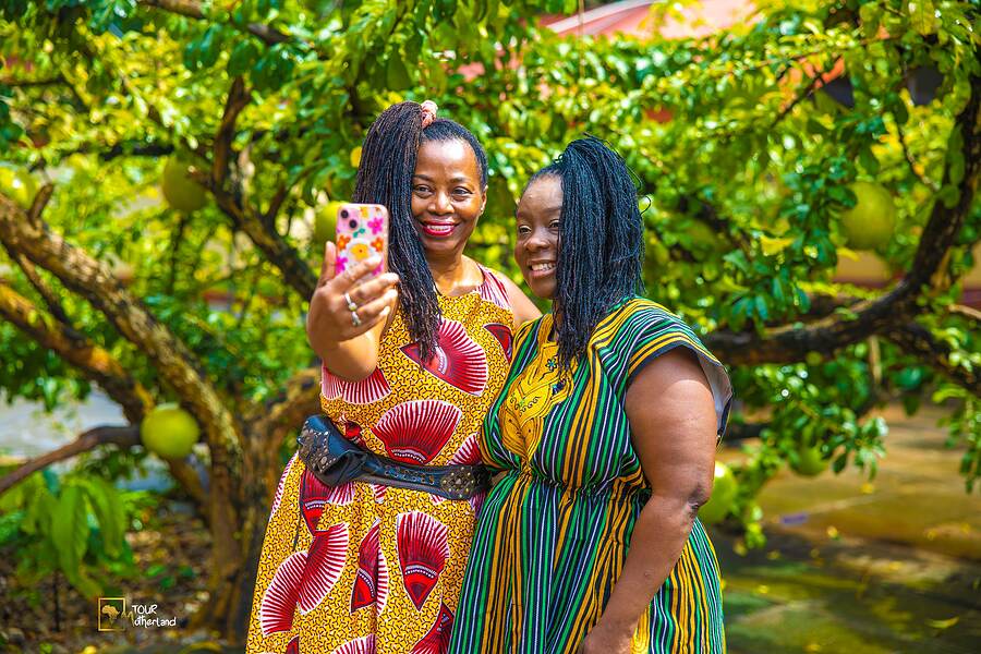 Photographing each other under the fruit trees